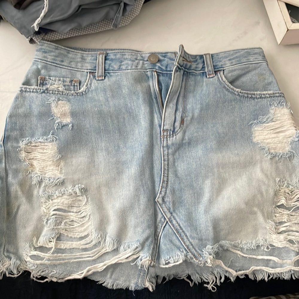 Distressed denim mini skirt